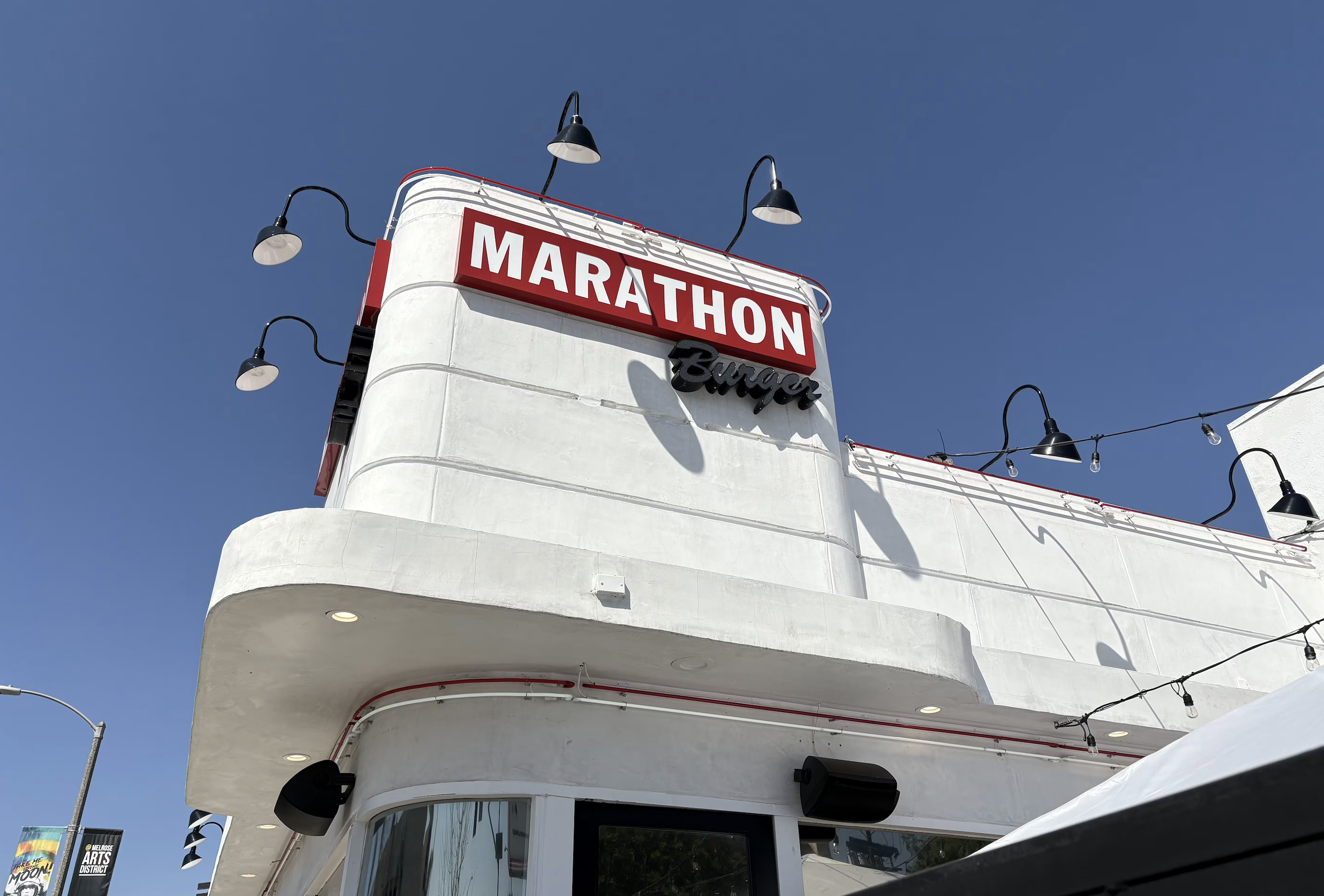 Nipsey Hussle’s Marathon Burger has Grand Opening in Long Beach Location With help From Snoop Dogg￼￼